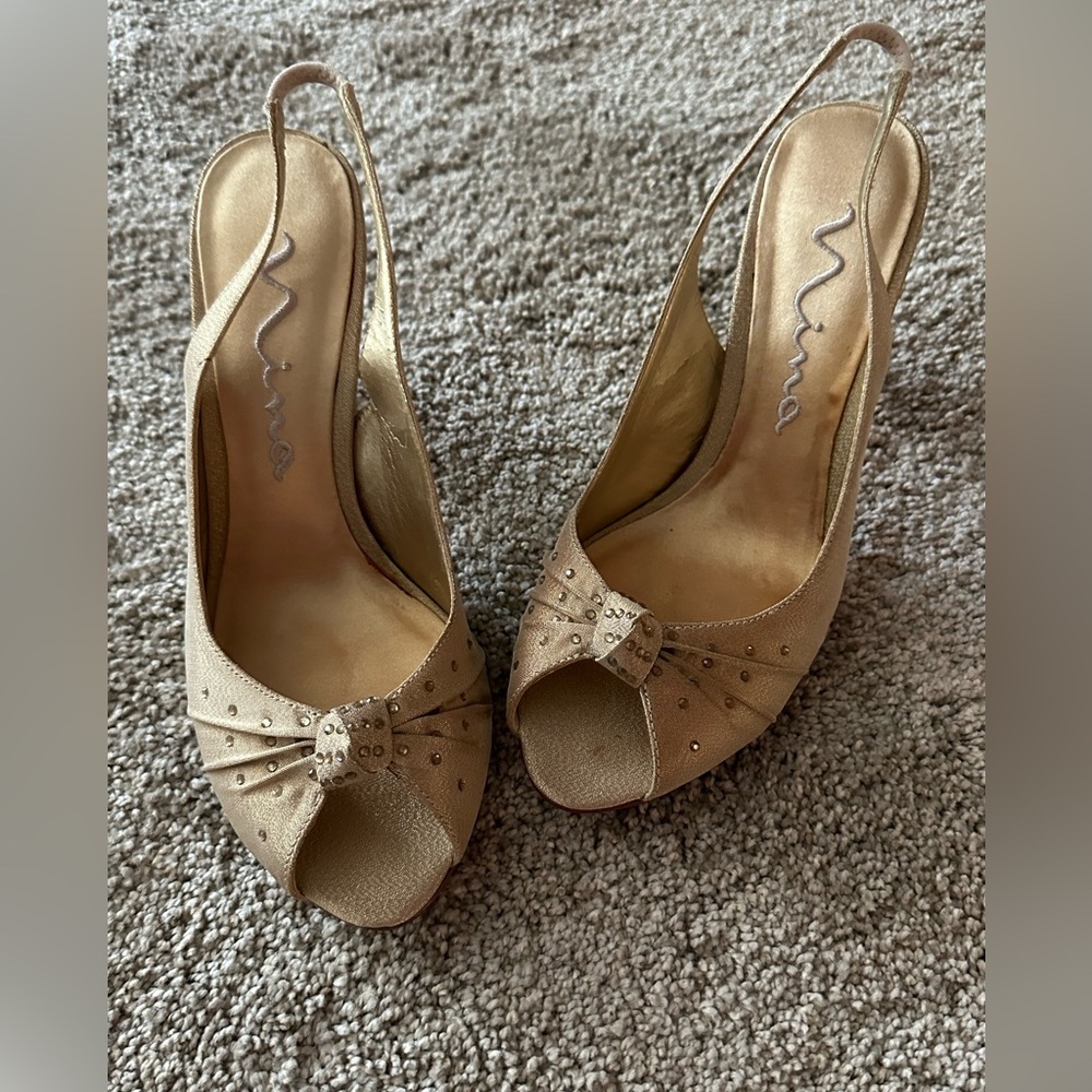 Nina brand rhinestone embedded sling back heels.